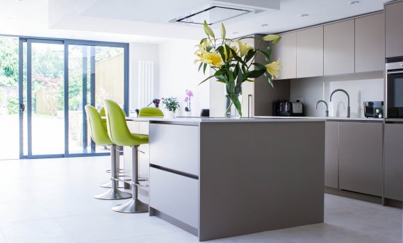 Completely refurbished kitchen with light brown furniture and white walls