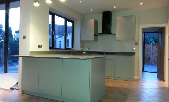 Kitchen with furniture, window and wooden floor