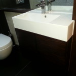 White sink with brown furniture