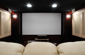Home cinema projector in basement